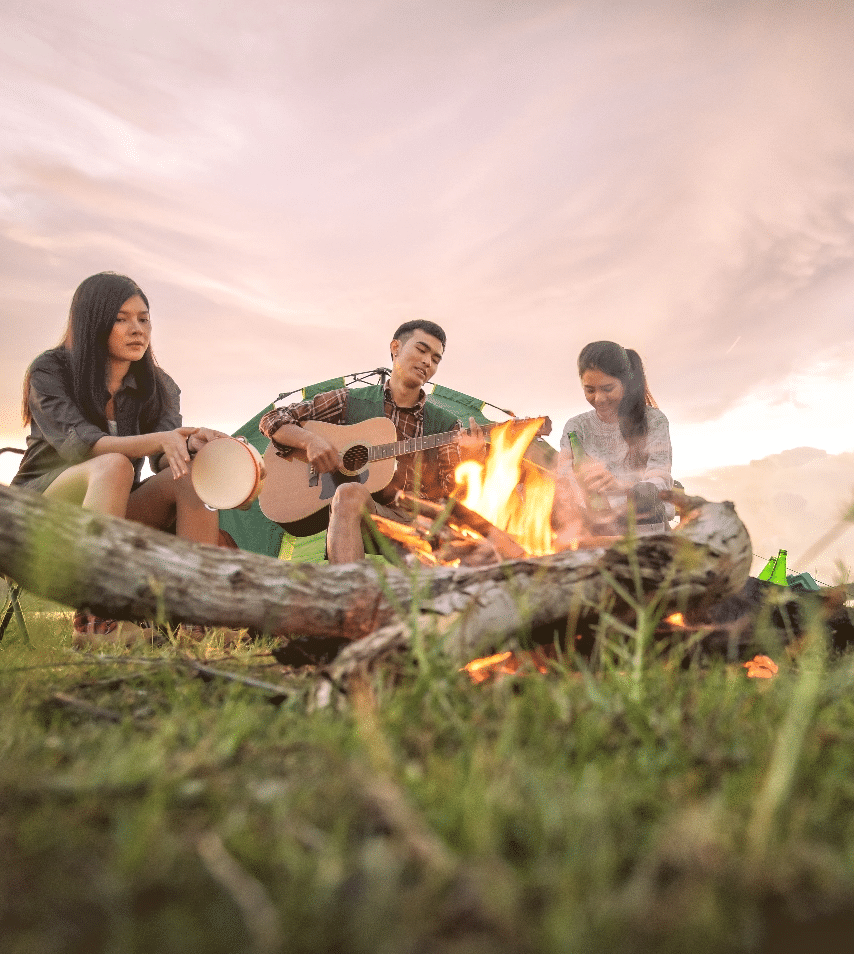People Playing Music Around a Comapfire