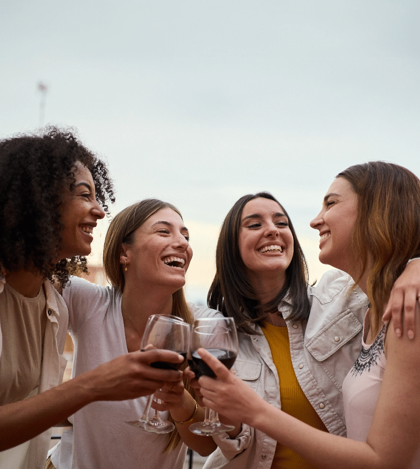 Women Laughing and Drinking Wine